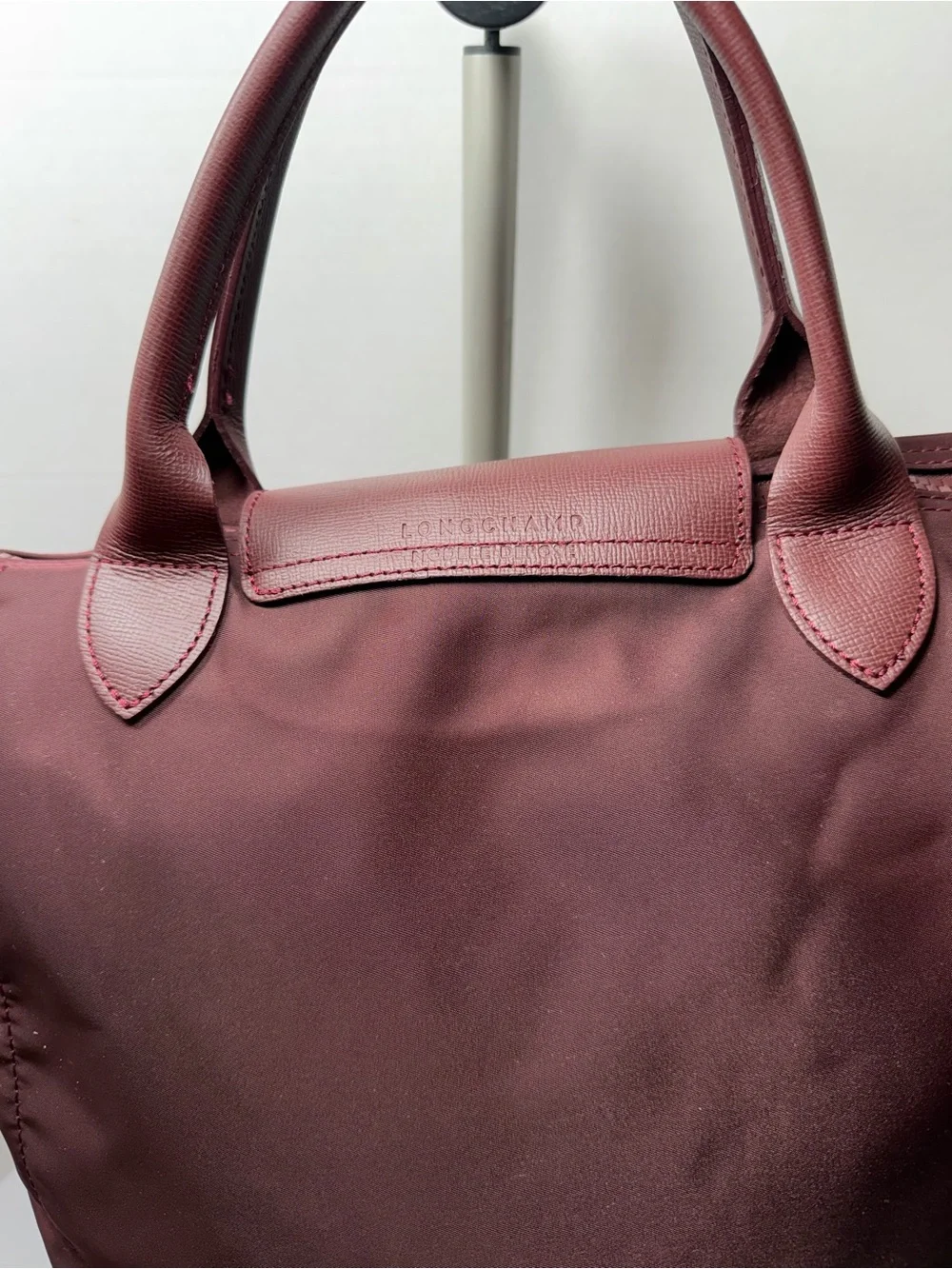 LONGCHAMP Burgundy medium Le Pliage tote from LONGCHAMP featuring leather trim